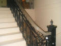 Wood Stair railings with decorative metal inlays Vancouver